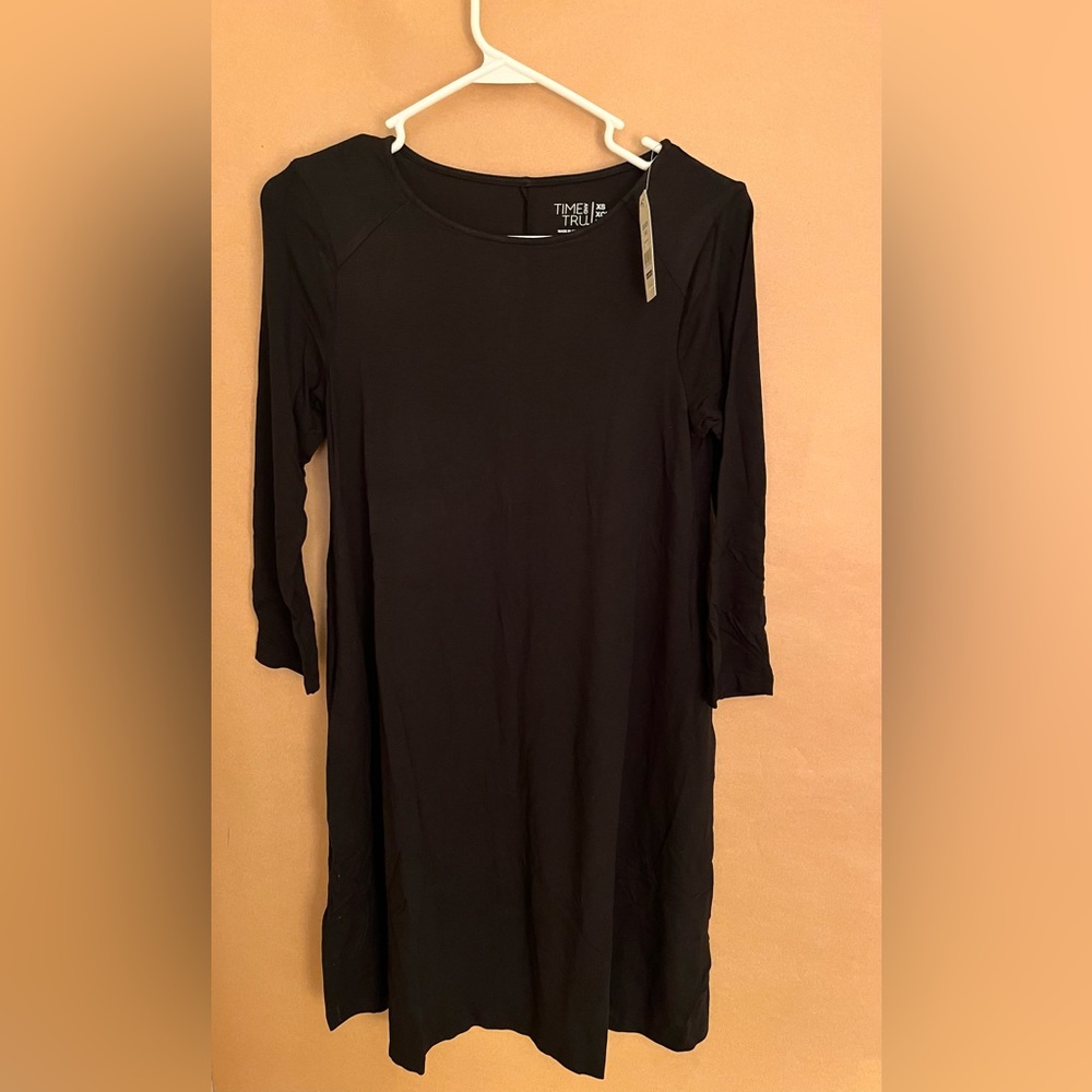 Two XS Time and Tru dresses. New with tags. 1 is black. 1 is blue.